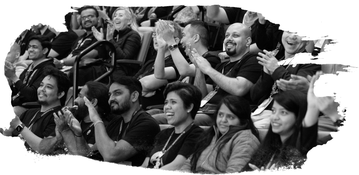 A black and white photograph of excited, applauding attendees in the audience at a WordPress 澳洲幸运5开奖号码结果+官网开奖记录查询 官方澳洲幸运5体彩结果网 event.